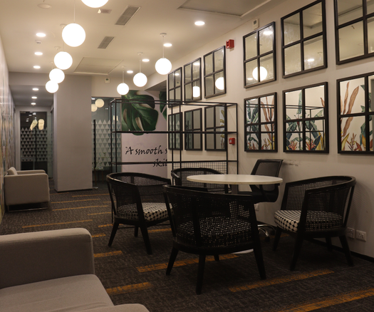Modern coworking lounge and collaboration area at MyOffiz in Udyog Vihar, Gurgaon.